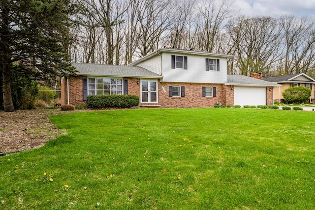 view of front of property with a garage, a chimney, a front lawn, and brick siding