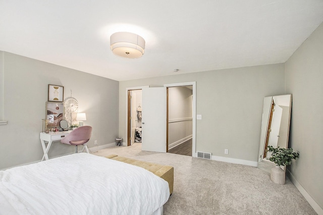 bedroom with baseboards, carpet flooring, and visible vents