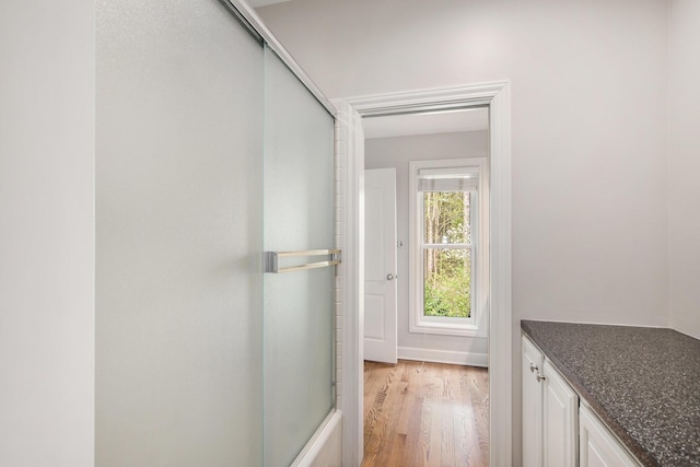 doorway to outside with light wood finished floors