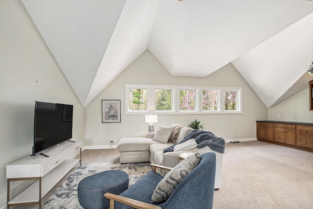 living area with baseboards, plenty of natural light, and light colored carpet