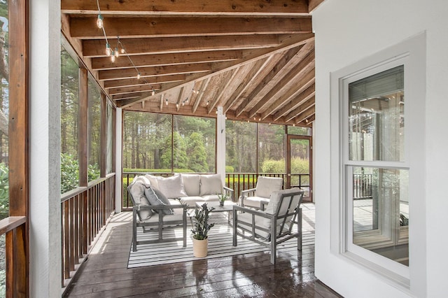 sunroom / solarium featuring an outdoor hangout area and a healthy amount of sunlight