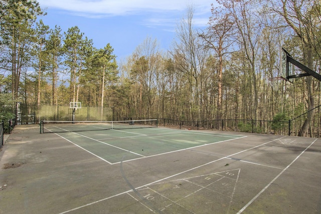 view of tennis court with fence