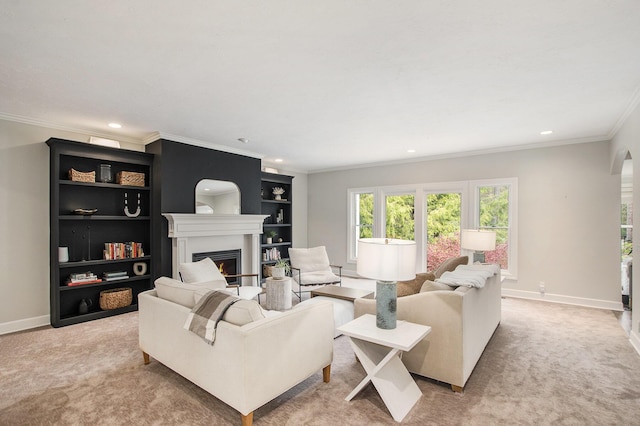 living room with recessed lighting, ornamental molding, baseboards, and a lit fireplace