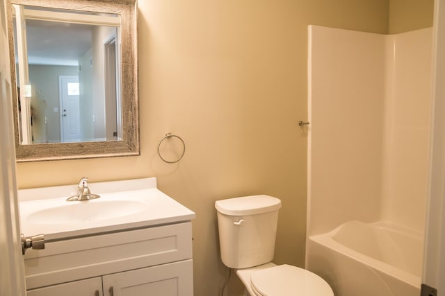 bathroom featuring toilet and vanity
