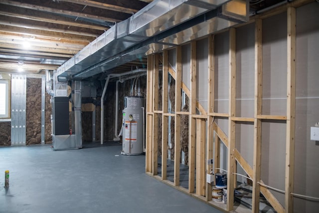 unfinished basement featuring heating unit and water heater