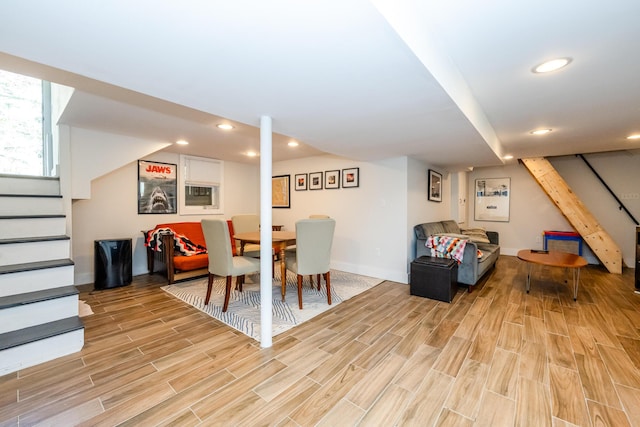 interior space with baseboards, recessed lighting, and light wood finished floors