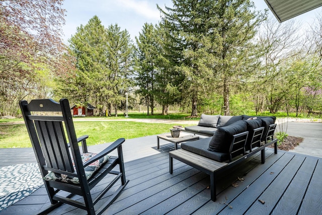 deck featuring a yard and an outdoor living space