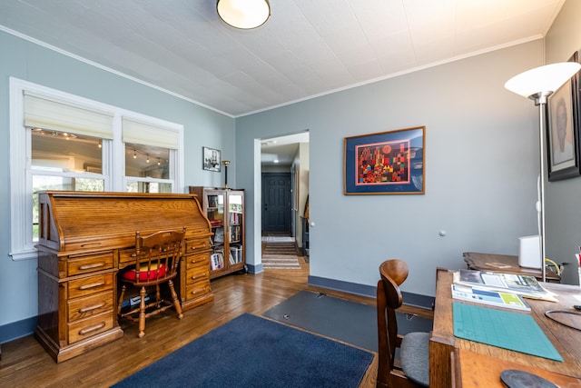 office area featuring baseboards, ornamental molding, and wood finished floors
