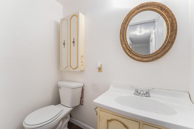 10145 W Kl Ave, Kalamazoo, MI 49009 - bathroom with toilet, baseboards, and vanity