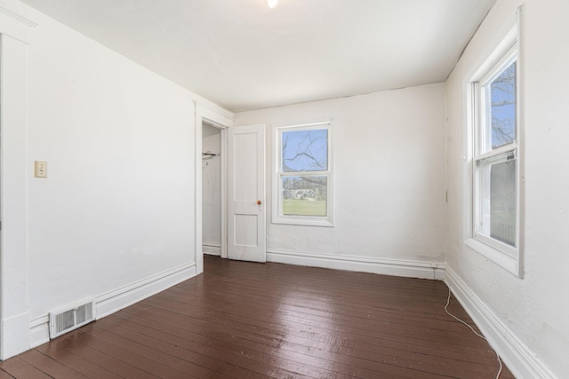 10145 W Kl Ave, Kalamazoo, MI 49009 - unfurnished room featuring visible vents, plenty of natural light, and hardwood / wood-style flooring