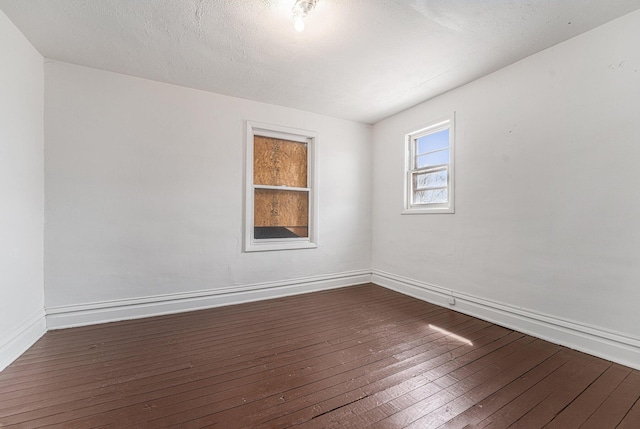 10145 W Kl Ave, Kalamazoo, MI 49009 - empty room featuring baseboards and dark wood finished floors