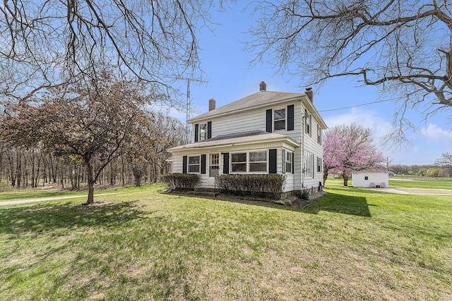 10145 W Kl Ave, Kalamazoo, MI 49009 - american foursquare style home featuring a front lawn and a chimney