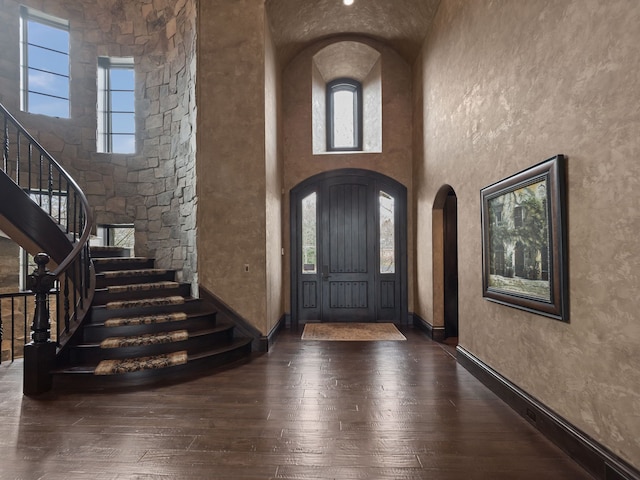 26565 Scenic, Franklin, MI 48025 - entryway featuring wood-type flooring, arched walkways, stairs, and baseboards