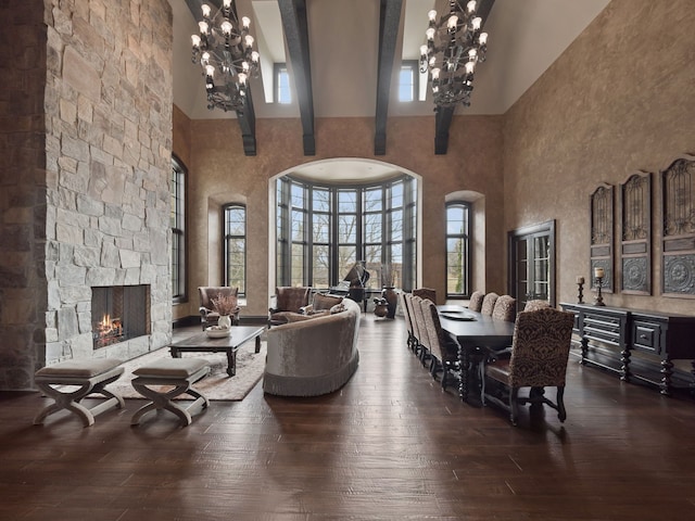 26565 Scenic, Franklin, MI 48025 - living room featuring a fireplace, an inviting chandelier, hardwood / wood-style floors, and a towering ceiling