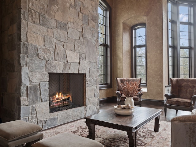 26565 Scenic, Franklin, MI 48025 - living area featuring baseboards, a stone fireplace, and wood finished floors