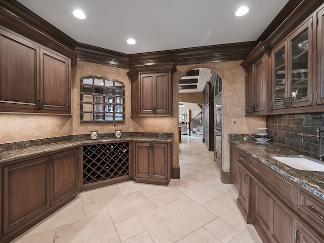 26565 Scenic, Franklin, MI 48025 - bar with a sink, arched walkways, ornamental molding, and backsplash