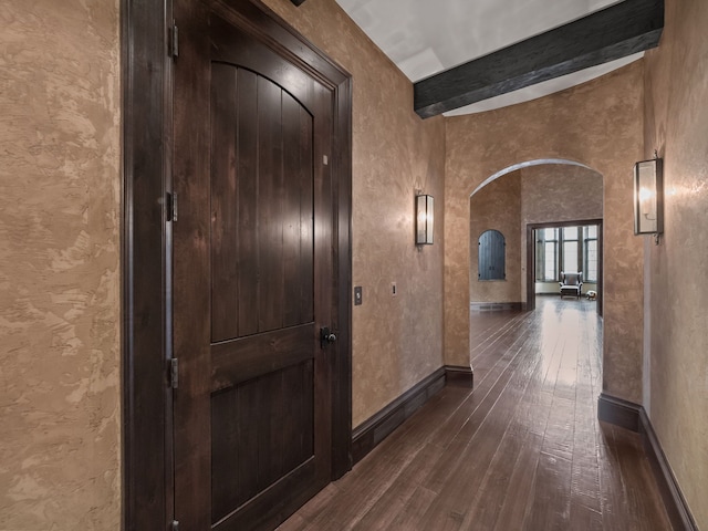 26565 Scenic, Franklin, MI 48025 - hallway featuring baseboards, arched walkways, dark wood-style flooring, and beamed ceiling
