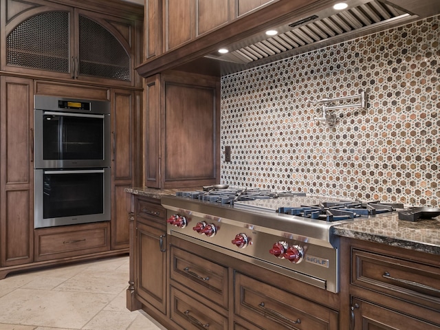 26565 Scenic, Franklin, MI 48025 - kitchen with dark stone counters, stainless steel appliances, glass insert cabinets, and premium range hood