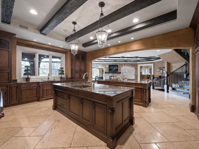 26565 Scenic, Franklin, MI 48025 - kitchen featuring stone tile flooring, a sink, a center island with sink, and recessed lighting