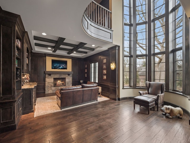 26565 Scenic, Franklin, MI 48025 - living area featuring a wealth of natural light, a stone fireplace, and dark wood-type flooring