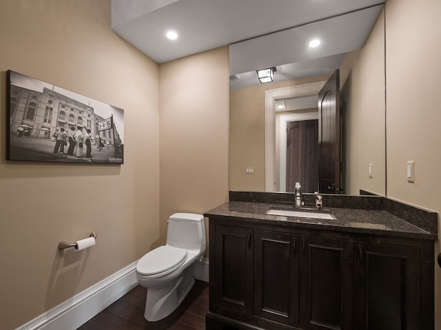 26565 Scenic, Franklin, MI 48025 - half bathroom with baseboards, wood finished floors, toilet, and vanity