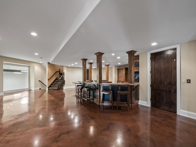 26565 Scenic, Franklin, MI 48025 - bar with stairway, baseboards, indoor bar, and concrete floors