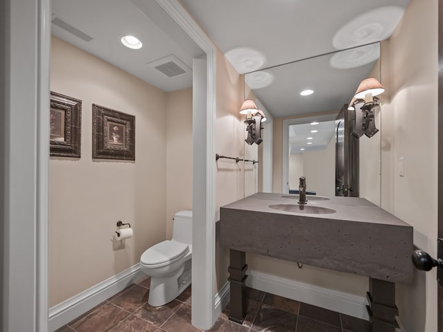 26565 Scenic, Franklin, MI 48025 - half bathroom with toilet, baseboards, visible vents, and vanity