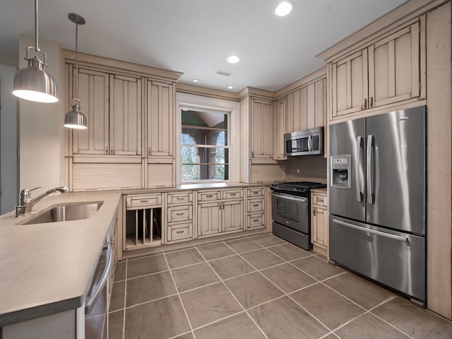 26565 Scenic, Franklin, MI 48025 - kitchen with a sink, appliances with stainless steel finishes, decorative light fixtures, and cream cabinetry
