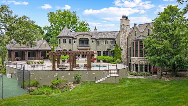 26565 Scenic, Franklin, MI 48025 - back of house with fence, a pergola, an outdoor pool, a patio area, and a yard