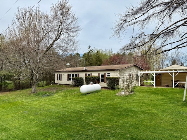 back of house with a yard