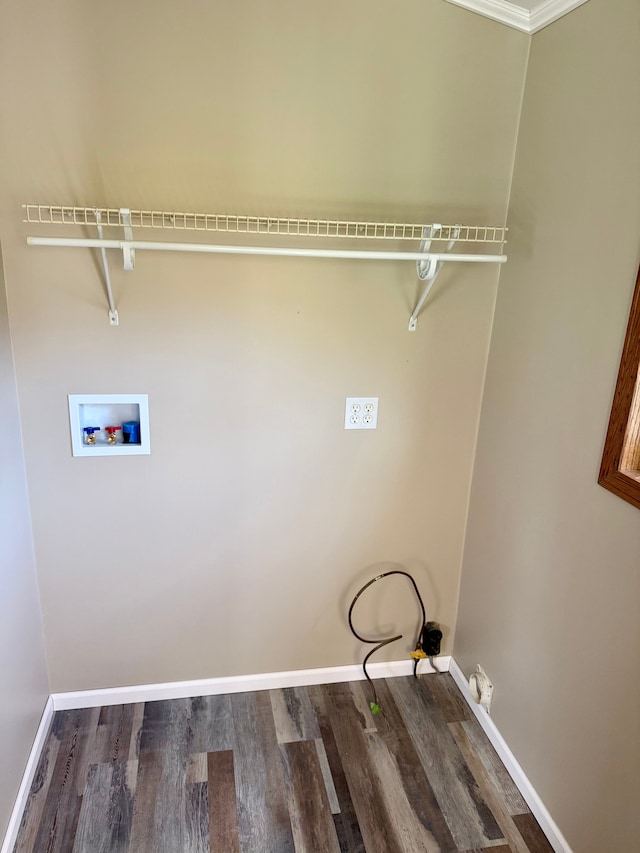washroom with laundry area, hookup for a washing machine, baseboards, and wood finished floors