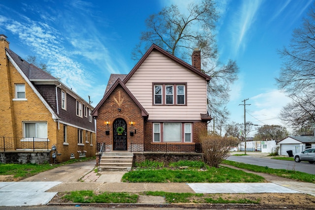 17215 Warrington Dr, Detroit, MI 48221 - tudor home featuring brick siding and a chimney