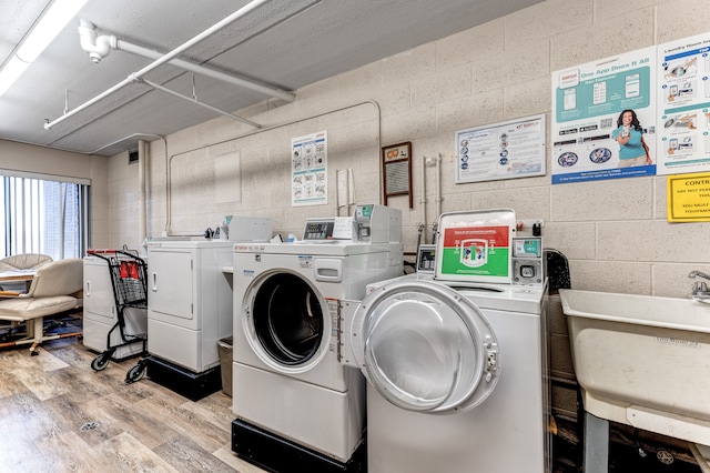 21800 Morley Ave Unit 619, Dearborn, MI 48124 - community laundry room with light wood finished floors, washer and clothes dryer, and a sink
