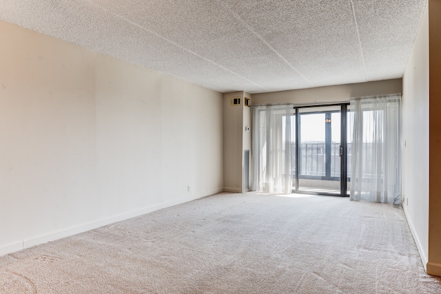 21800 Morley Ave Unit 619, Dearborn, MI 48124 - spare room featuring carpet, a textured ceiling, and baseboards