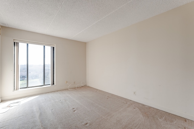 21800 Morley Ave Unit 619, Dearborn, MI 48124 - spare room featuring a textured ceiling, baseboards, and carpet floors