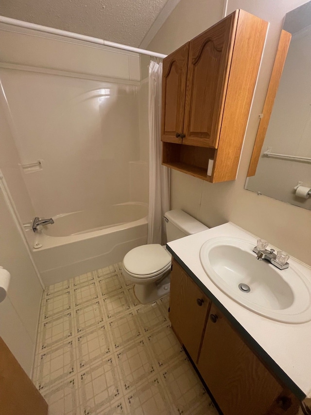bathroom with vanity, shower / bath combination with curtain, toilet, a textured ceiling, and tile patterned floors