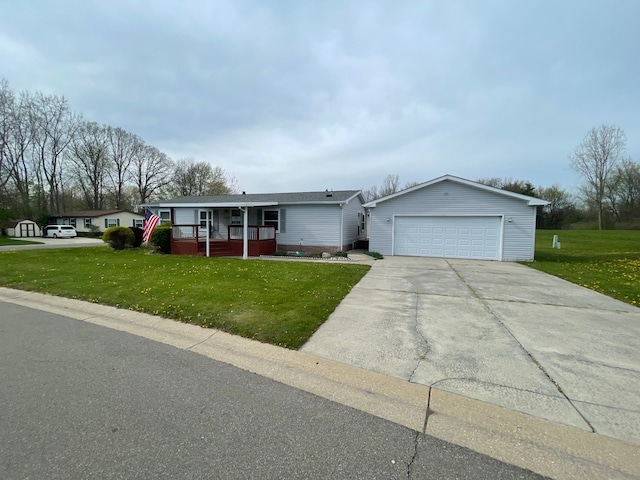 ranch-style house with covered porch, a front yard, and a garage