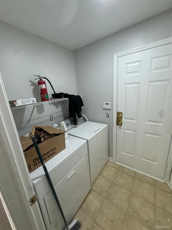 laundry area with laundry area and washer and clothes dryer