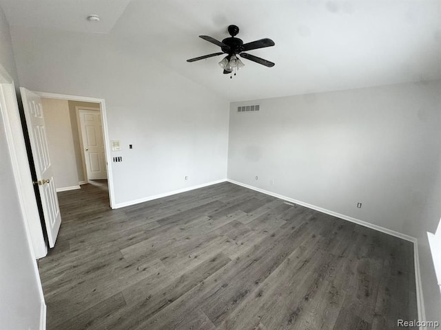 unfurnished room featuring ceiling fan, vaulted ceiling, dark wood-style floors, and visible vents
