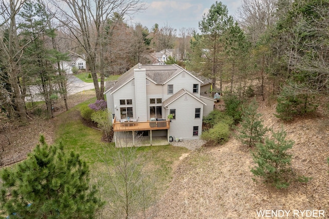 rear view of house featuring a deck