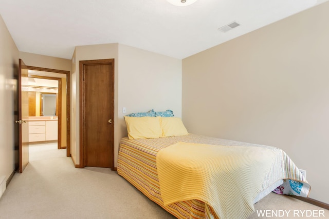 bedroom featuring light colored carpet, baseboards, and visible vents