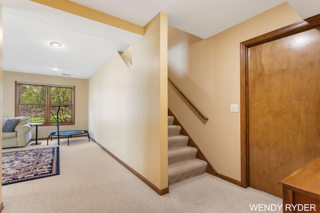 staircase with carpet flooring, recessed lighting, and baseboards