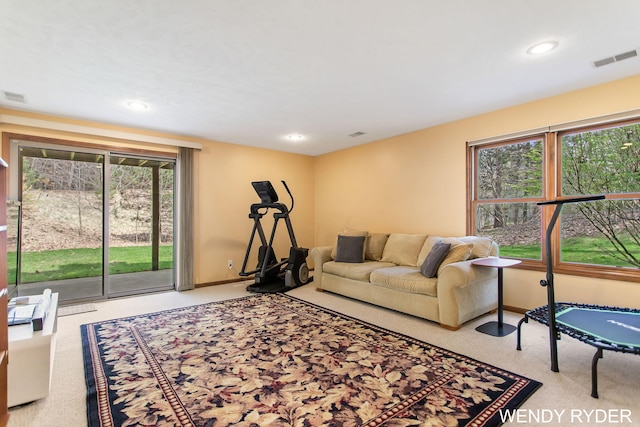 living room with visible vents, recessed lighting, and a wealth of natural light