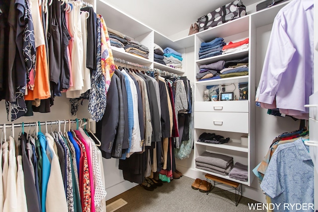 spacious closet featuring visible vents and carpet