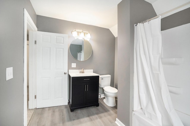 full bath featuring toilet, a shower with curtain, wood finished floors, and vanity