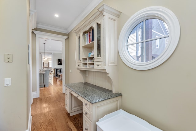 hall featuring crown molding, recessed lighting, and light wood-style flooring