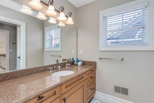 bathroom featuring vanity and visible vents