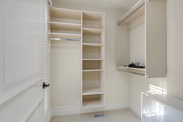 walk in closet with visible vents