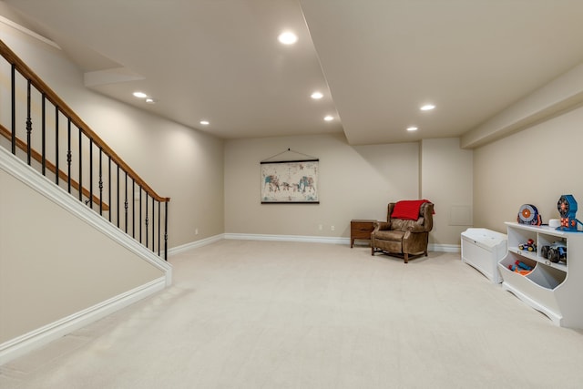 living area featuring baseboards, carpet flooring, recessed lighting, and stairs