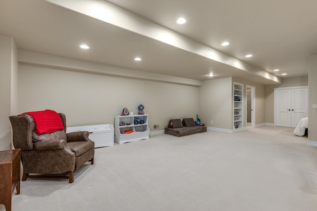 living area featuring baseboards, light carpet, recessed lighting, and visible vents